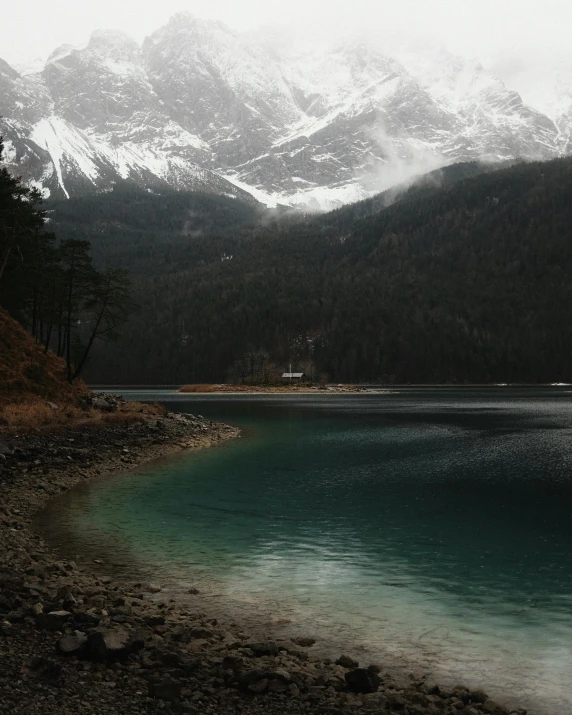 the mountains are covered in snow in the cold