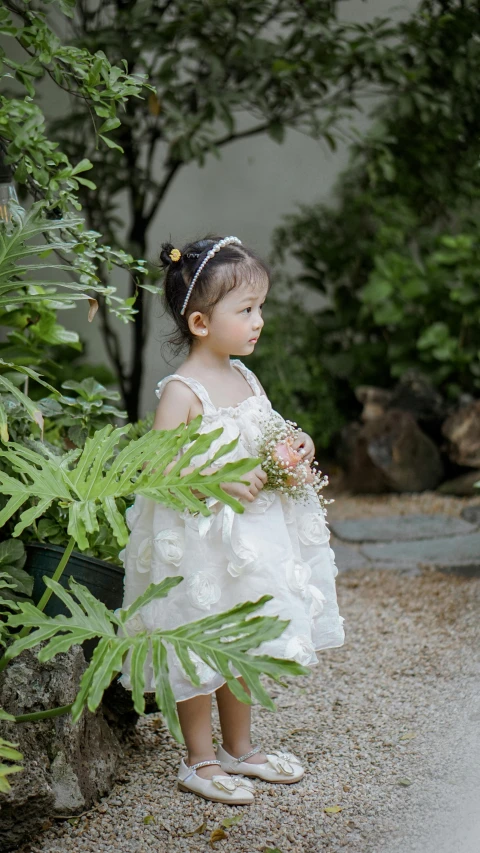 a  is holding flowers in her hand