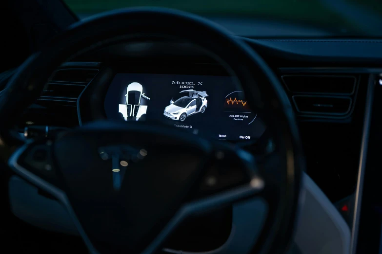 the steering wheel and dashboard of a car