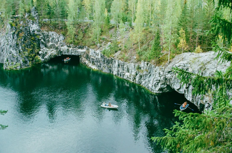 boats traveling through an outdoor deep blue water