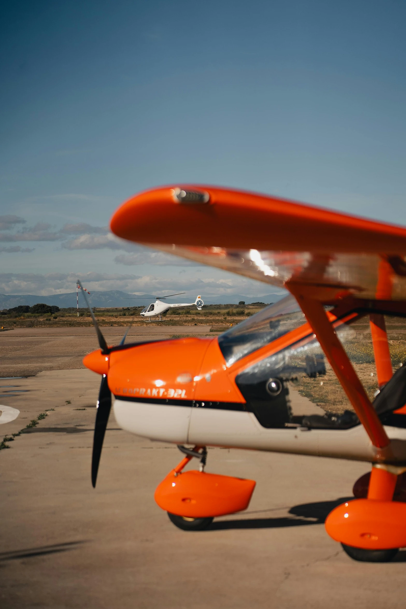 a small propeller plane sits on the runway