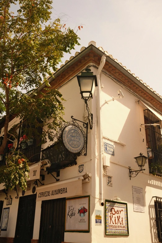 the front facade of a building with a sign for a cafe