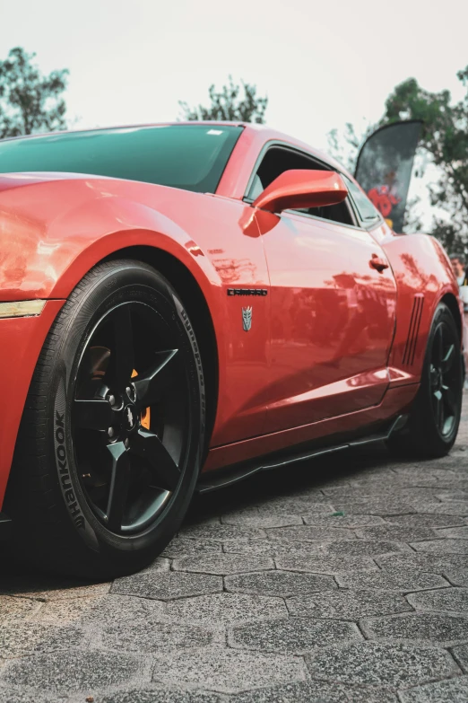 the front end of a red sports car