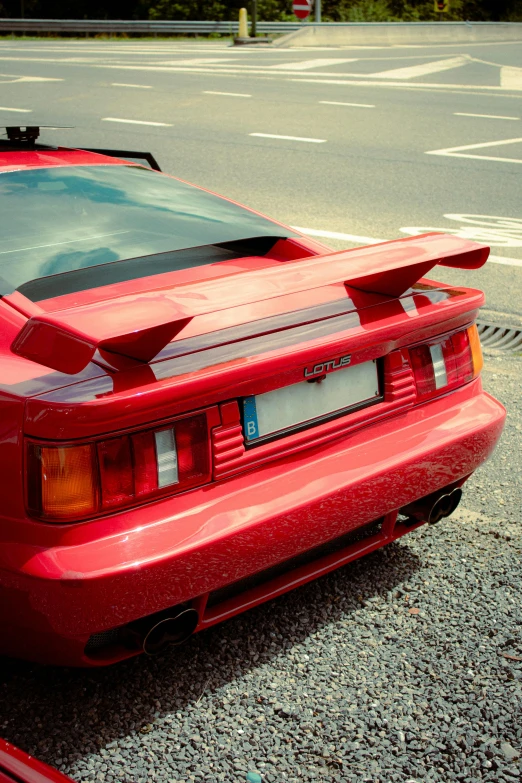 a red sports car parked near the side of a street