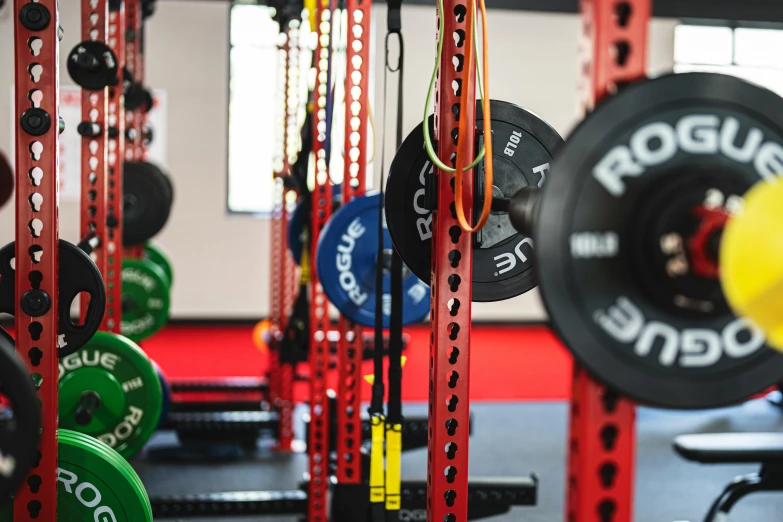 the gym area has a number of colored bars in it