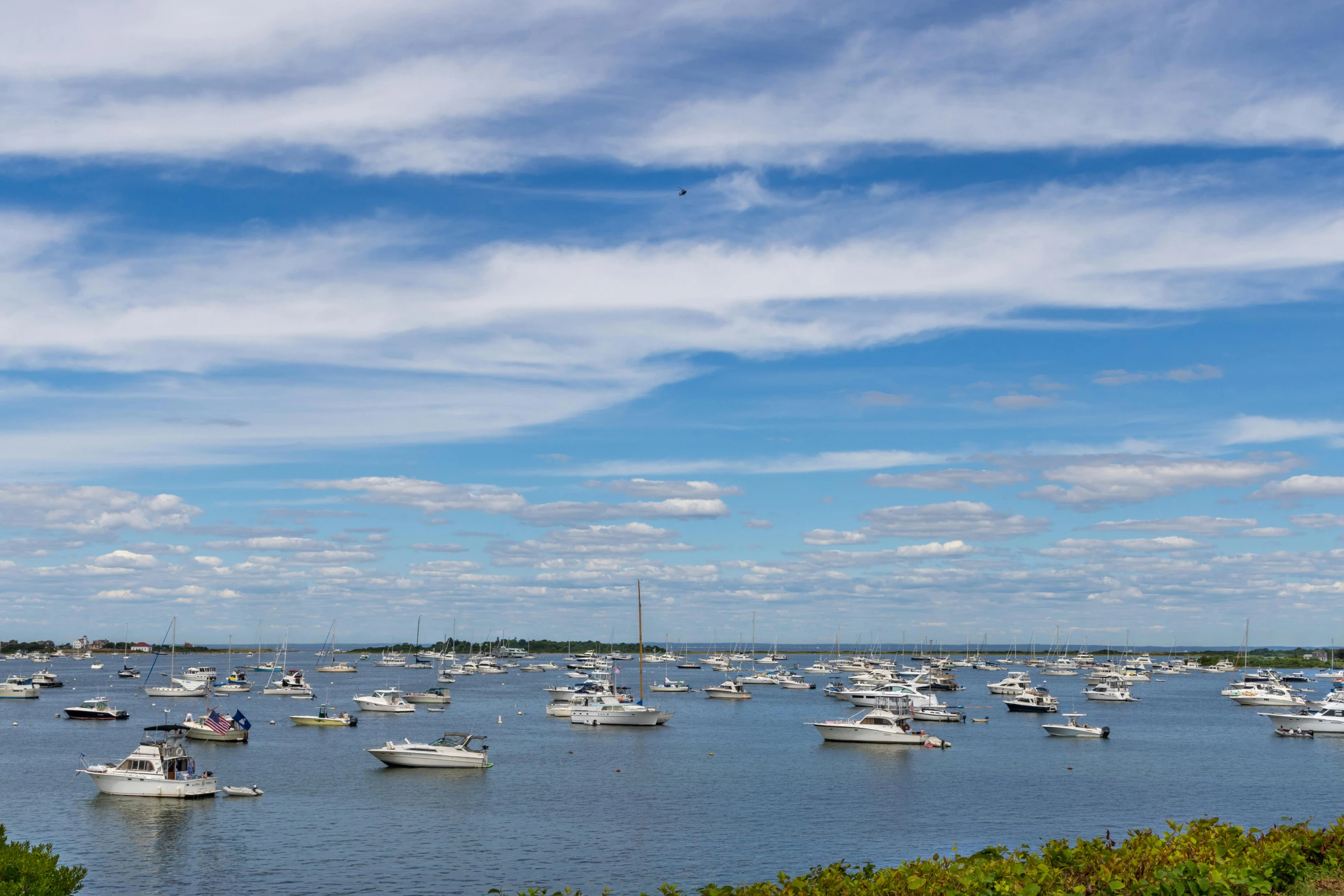 the boats are out on the water on a sunny day