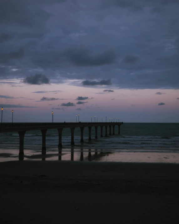 an empty pier in the middle of the water