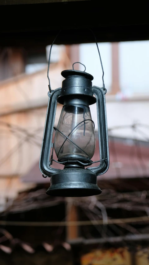 the lantern is lit up on the outside of the house