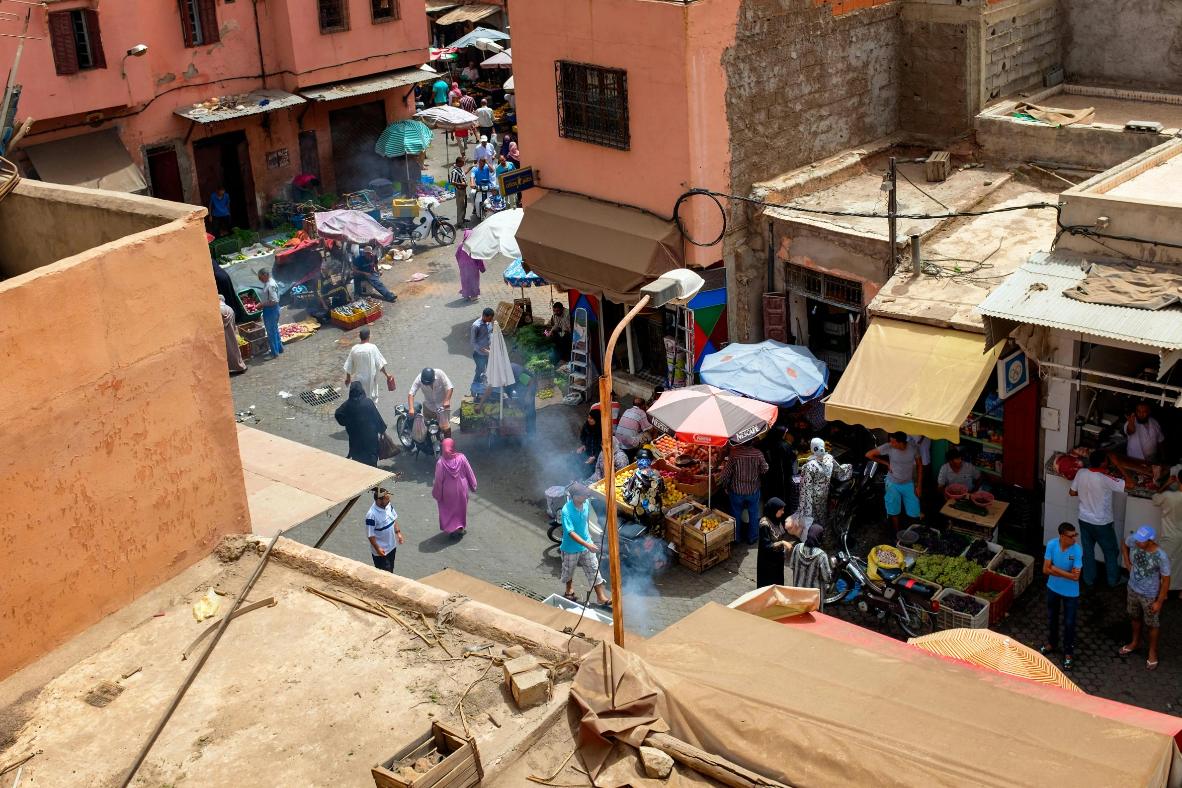 a town view from above shows a city's alley and buildings