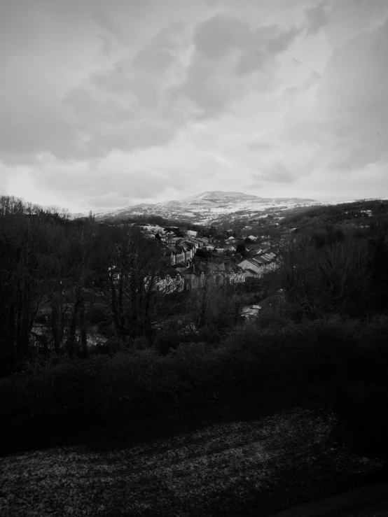 black and white po of a hilly hillside in the distance