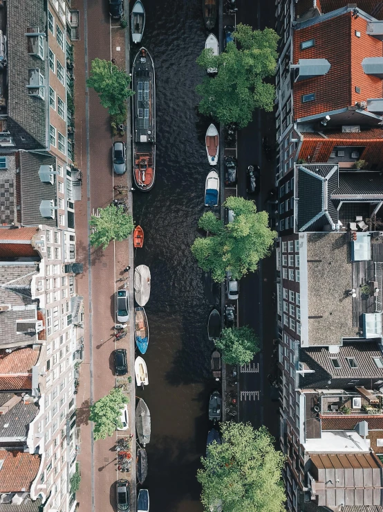 the view from a helicopter shows boats in a canal