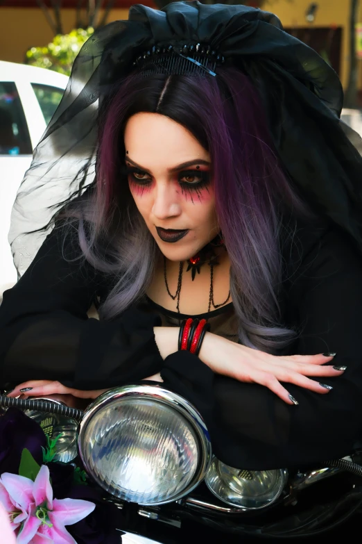 a women with long dark hair and makeup on posing for a po