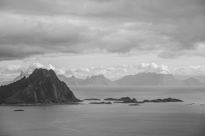 a black and white image of mountains in an area