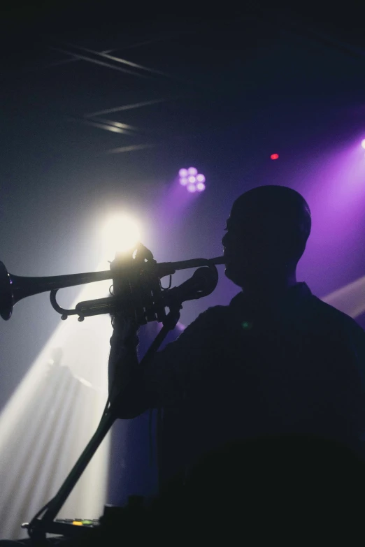 the musician is playing his trombone during the concert