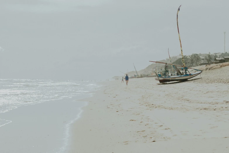 there is a boat that has landed on the beach