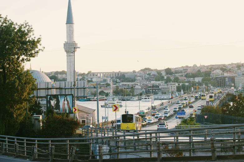 a busy city with lots of traffic and a large clock tower