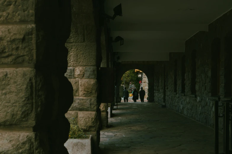 a brick path with people walking down it