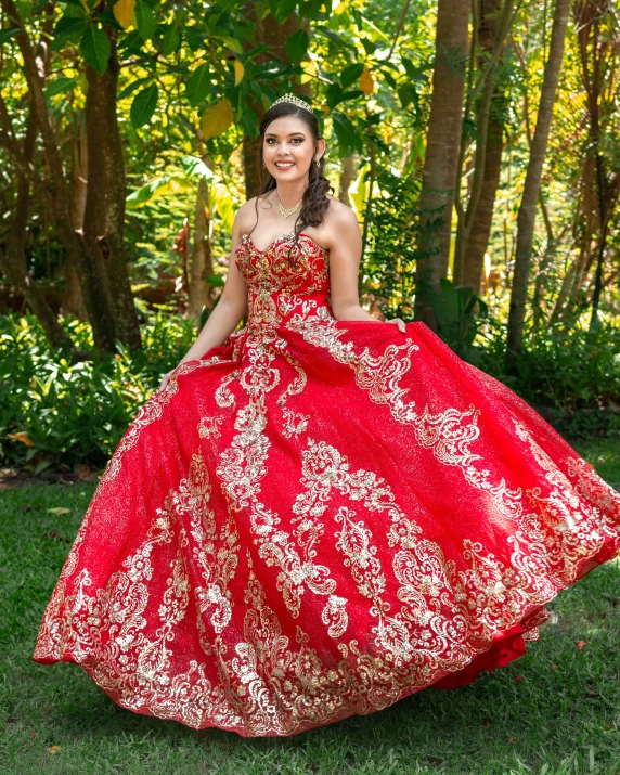 a woman is in an elaborate red dress