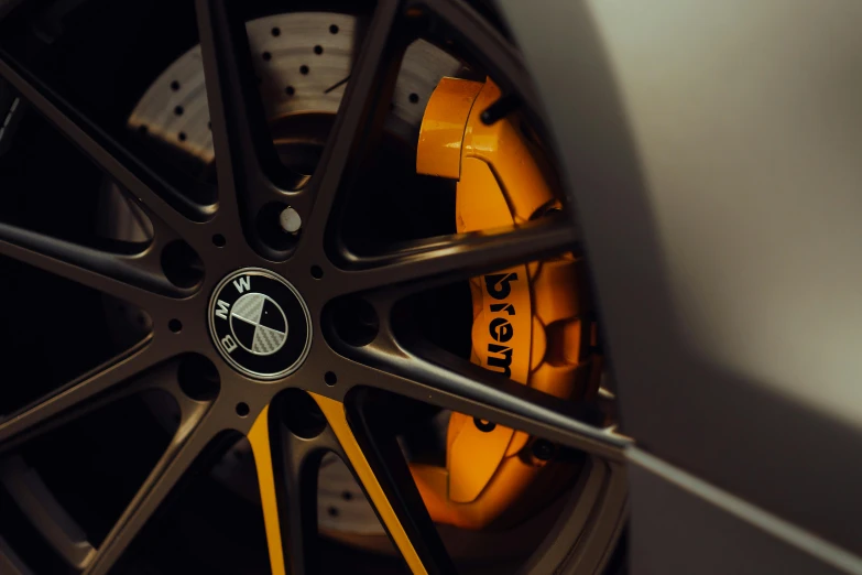 a closeup image of the spokes and rim of a sports car