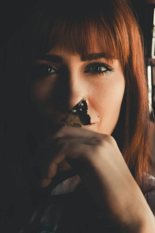 a woman eating food from her mouth with fork