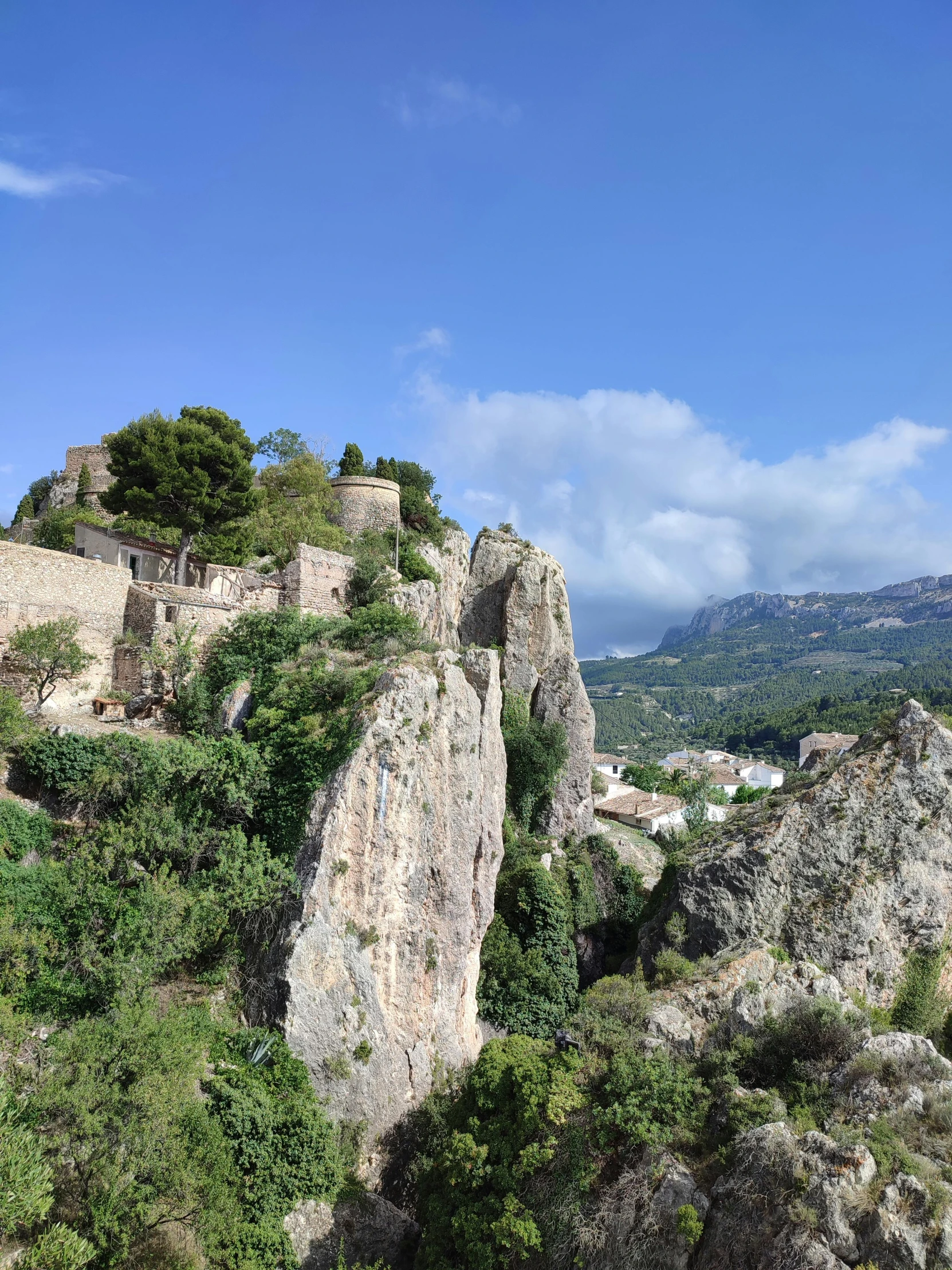 a view of an old castle building on top of a cliff