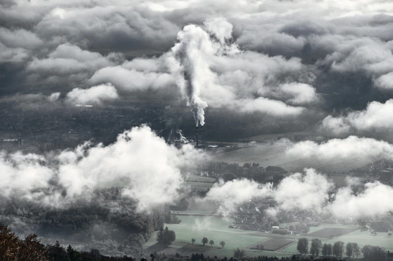 the sky is filled with a cloud covered city