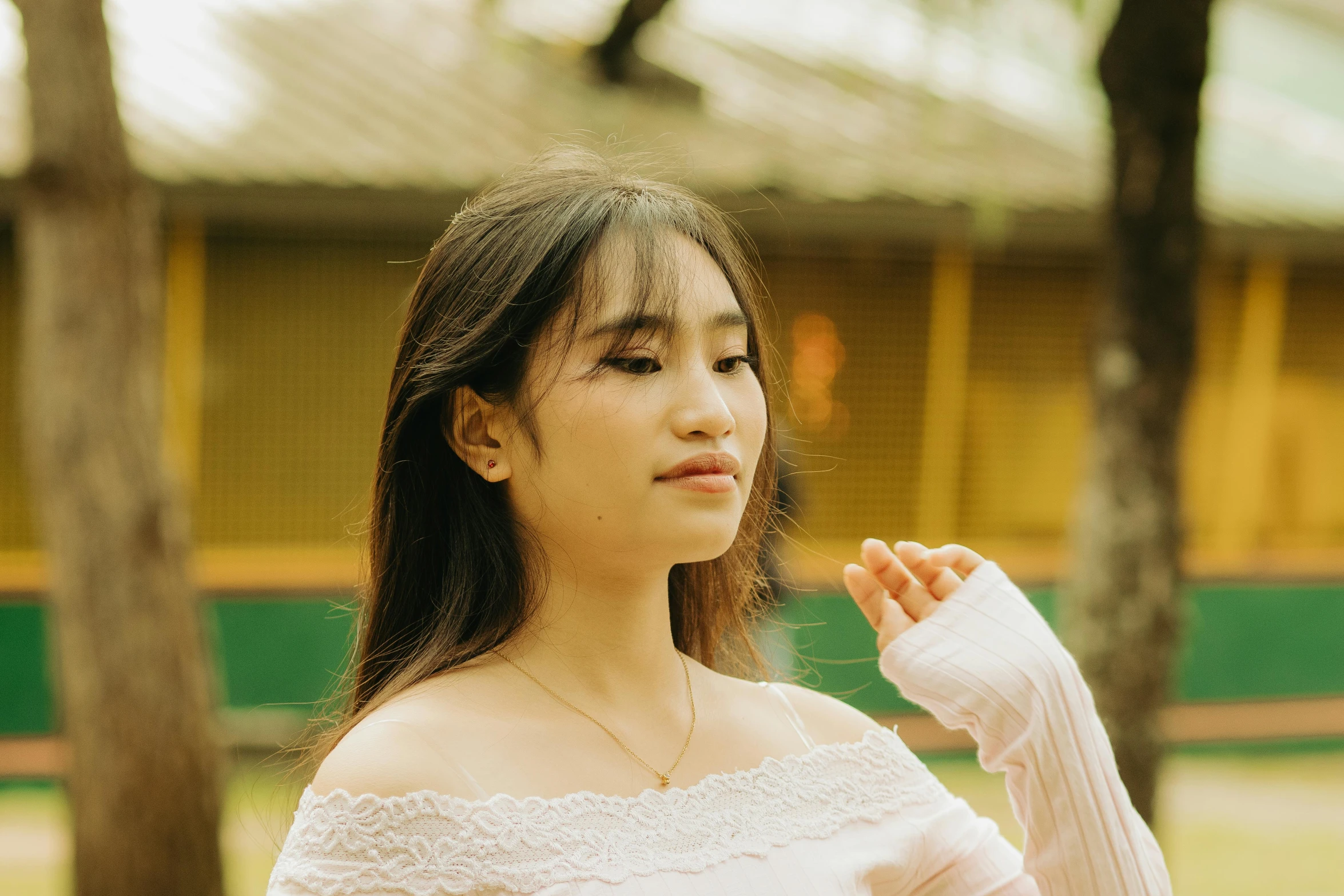 a young woman with arm cast on looking back