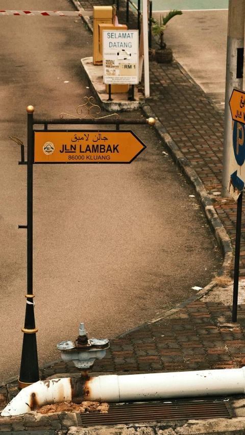 street signs on the side of the road saying jels lamkak