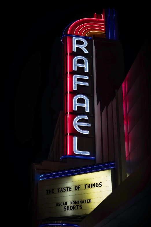 an illuminated sign on the side of a building