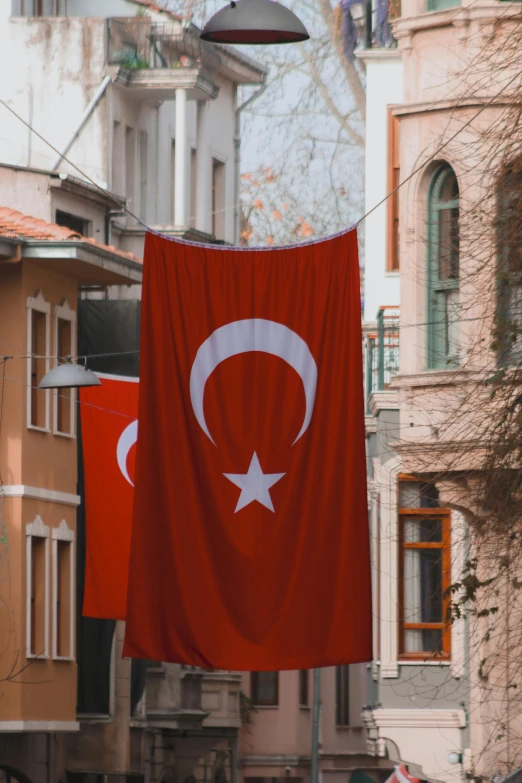 a flag hanging from the side of a building