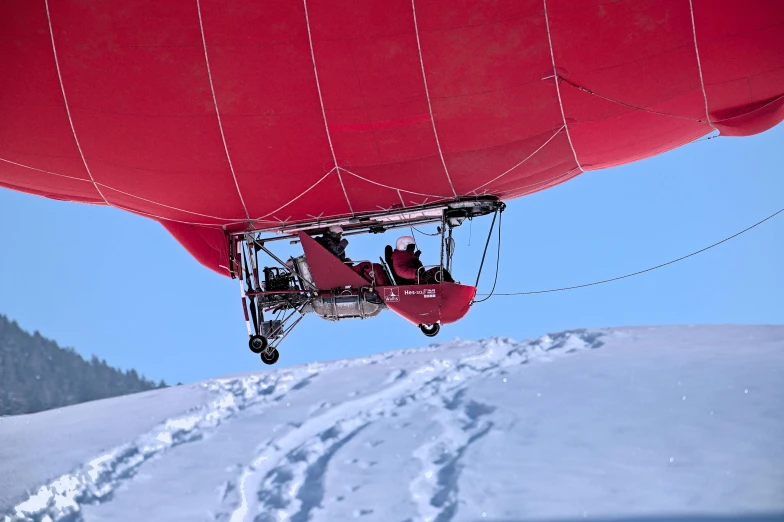 there is a skier that is attached to the mast of a ski lift