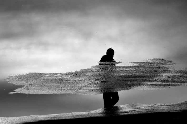 a surfer is holding his board and walking on the beach