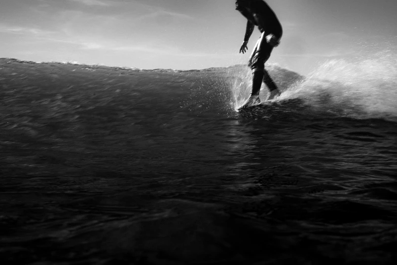 a person riding a wave on top of a surfboard