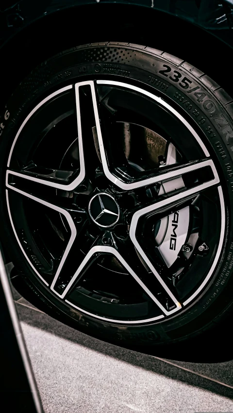 a close up of the spokes and tires of a sports car