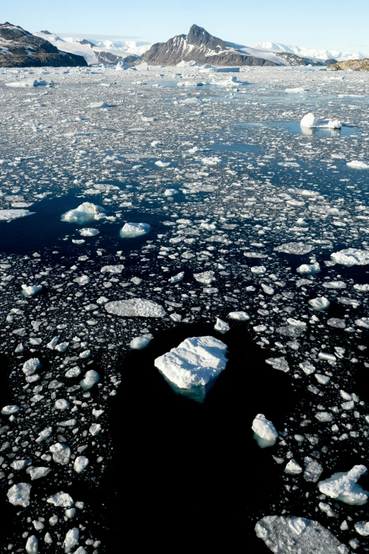 an icy lake surrounded by rocks and ice