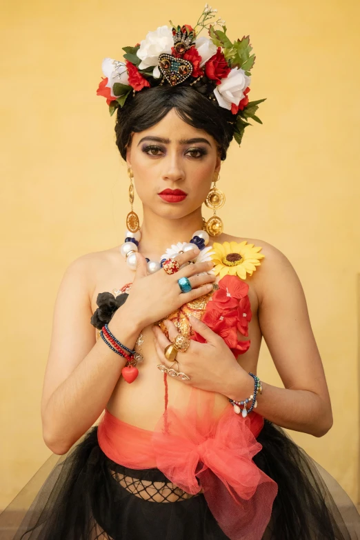 a woman dressed in an indian costume is holding onto her cell phone