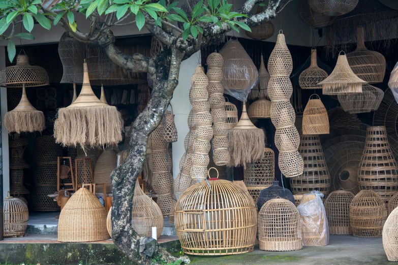 several large pieces of woven baskets set against the wall