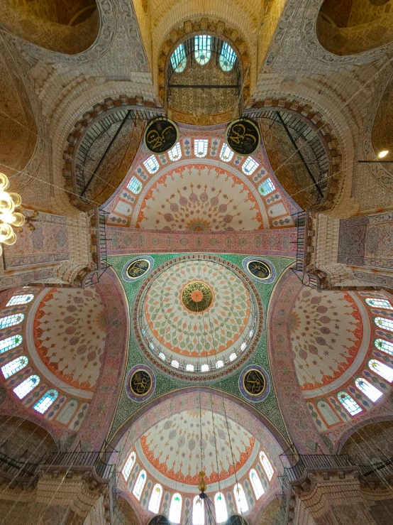 the ceiling inside an old building is decorated with colorful designs