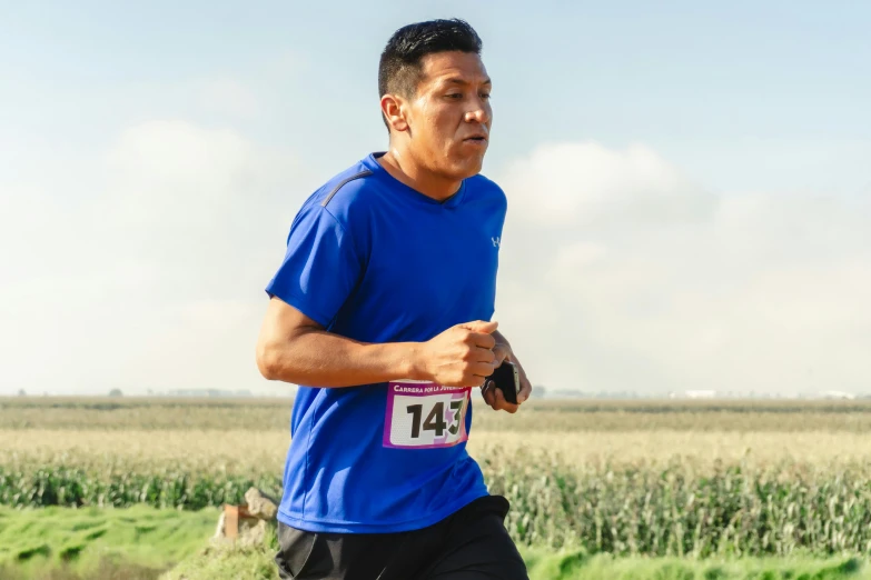 a man that is running through a field