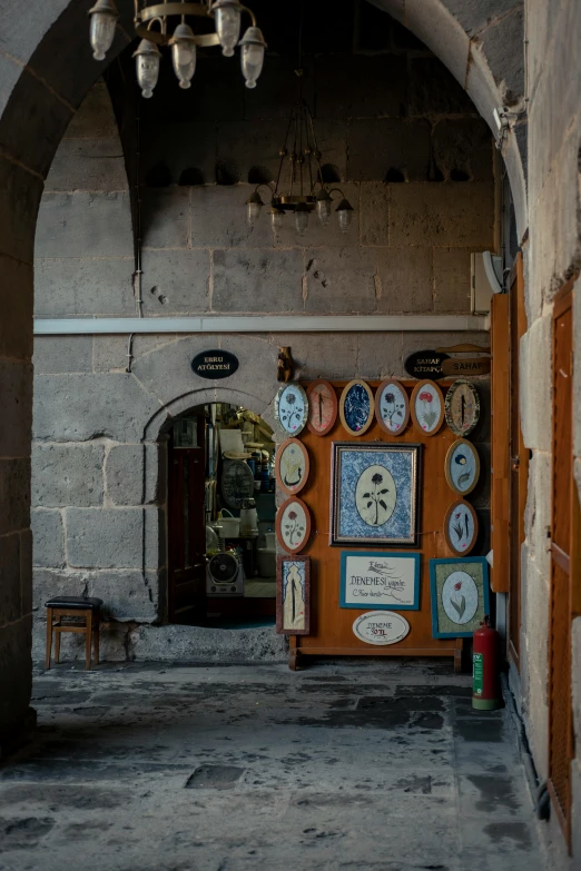 an archway leading to a large room filled with clocks