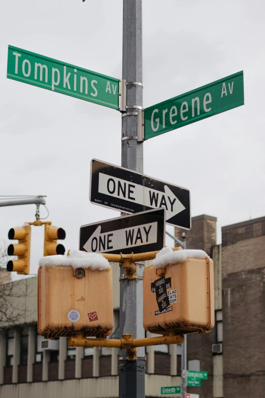 an intersection at a busy intersection on a cold day