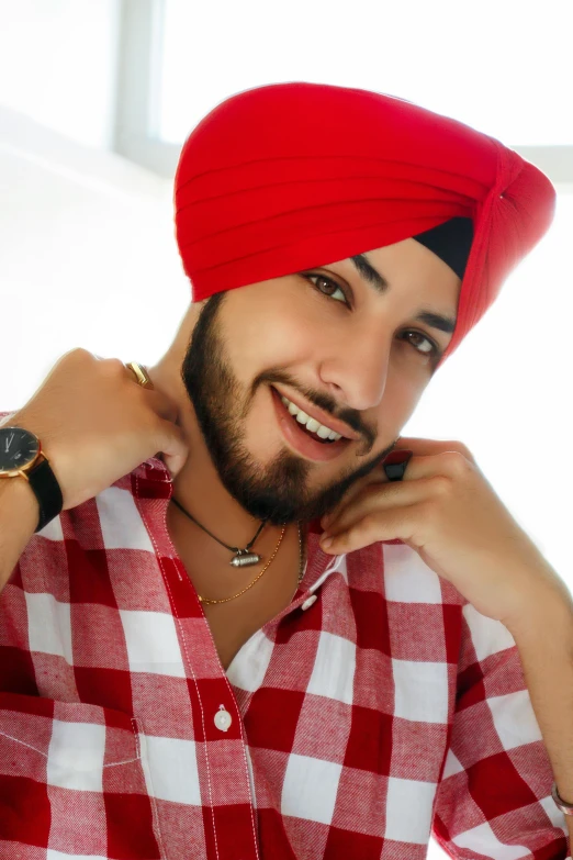 man wearing a red turban and watch