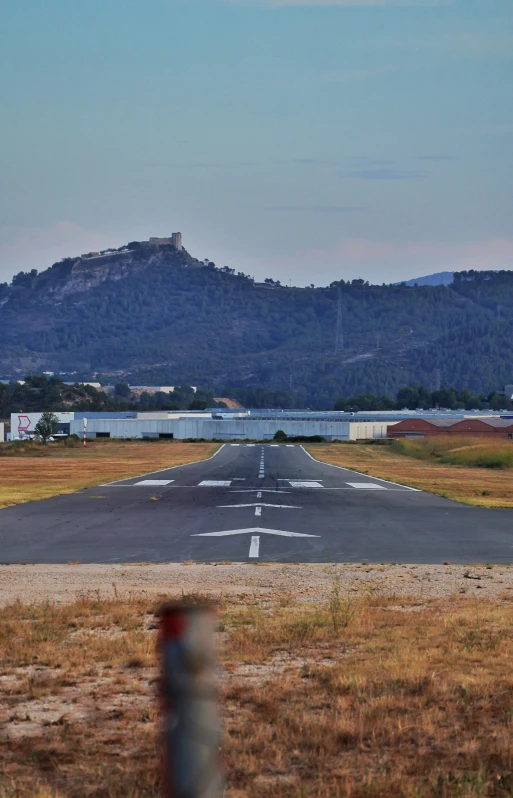 the airplane is landing at an airport and taking off