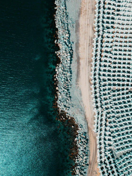 a beach is shown with many chairs lined up around it