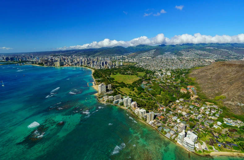 an aerial view of a beach and ocean in hawaii