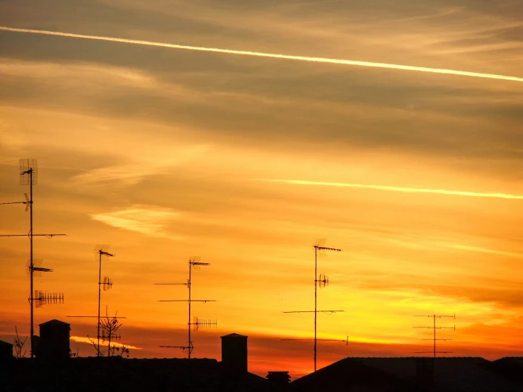 some radio towers that are in the dark