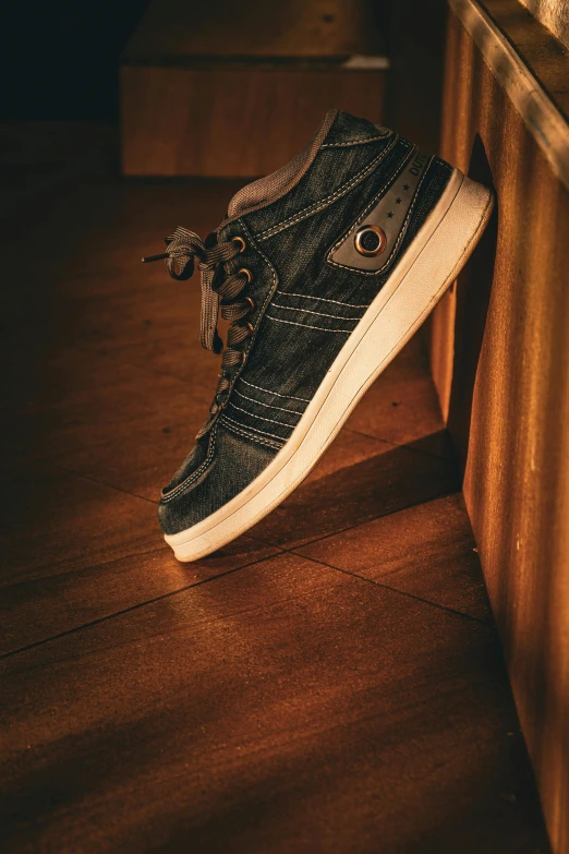 an old - fashioned sneaker hangs on the side of a table