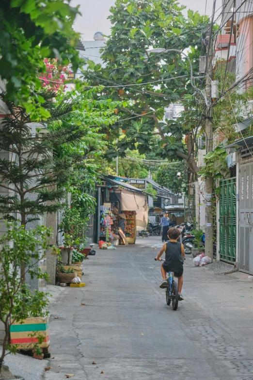 a person riding a bike down a road