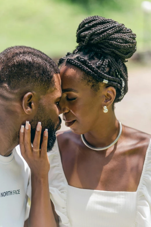 two people that are wearing different jewelry