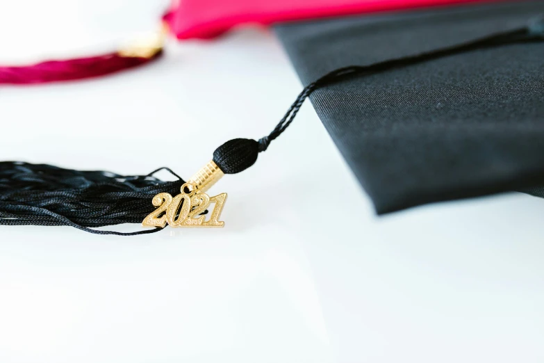 black colored tassel with golden clasp and cross pendant